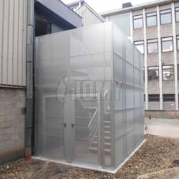 Enclosed staircase in aluminium Enclosed staircase in aluminium with perforated panels and security door.